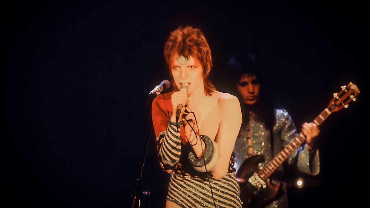 David Bowie as Ziggy Stardust singing